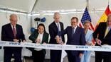 U.S. Sen. Jerry Moran and U.S. Rep. Sharice Davids, both at far left, helped open Indra Air Traffic Inc. in Overland Park, Kansas, in May 2023. 