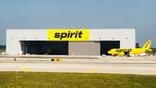 Spirit Airlines aircraft in front of hangar