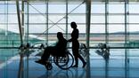 Man in a wheelchair at the airport