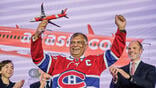 Tony Fernandes holding Airbus A220 model