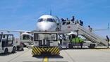passengers boarding an aircraft at Genova City Airport