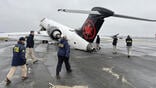 NTSB investigators around damaged Air Canada jet