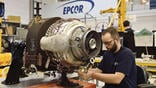 aircraft technician working on hardware