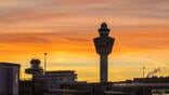 Schiphol Airport with a sunset in the background
