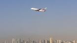 emirates jet flying above uae