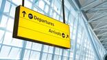 Departures and arrivals yellow sign