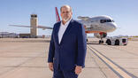 Jim Currier standing in front of Honeywell Aerospace Boeing 757