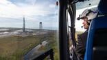 Isaacman in helicopter surveying Cape Canaveral SFS SLC-36 