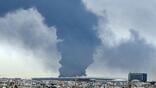Smoke billows following a strike at a fuel depot at Kuwait International Airport in Farwaniya Governorate, Kuwait, March 25, 2026