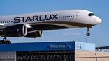Starlux A350 over American hangar