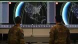 Space Defense Squadron members operate the ATLAS system 