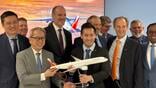 Philippine Airlines and Airbus officials unveil the A350-1000 commitment at the Farnborough Airshow.