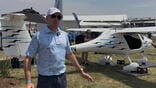 Chris Crow in front of Pipistrel Voyager