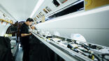 person fitting out aircraft cabin
