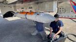 Underwing munition loading