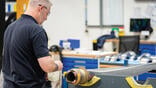 person working on fan blade