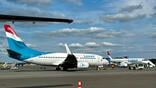 a Luxair 737-700 (which will be phased out) and to the right an E195-E2