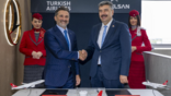 Turkish Airlines chairman Murat Şeker (left) and Havelsan general manager Mehmet Akif Nacar at the Farnborough signing for 12 simulators.