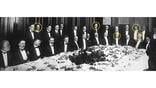 group of men at a dinner table with five heads circled