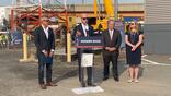 Bryan Bedford speaks during surface movement radar unveiling