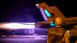 A U.S. Navy F/A-18 launches from the USS Abraham Lincoln on Aug. 12 in the Middle East. U.S. Navy photo