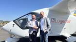 loganair ceo with beta tech ceo in front of aircraft
