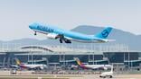 korean air aircraft takes off over airport terminal
