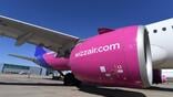 close-up of wizz air plane engine and wing