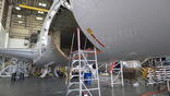 aircraft in hangar undergoing repair