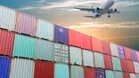 aircraft flying over containers