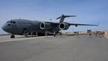 A U.S. Air Force C-17 and airmen arrive in the Middle East for a deployment in January.