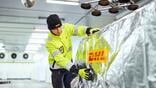 dhl worker securing shipment