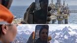 split image of two workers holding smartphones against offshore oil platform and snow-capped mountains