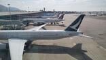 cathay pacific aircraft parked on tarmac