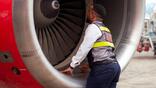 Man looking into jet intake