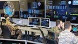 Soldiers at computers at NATO Space Operations Center