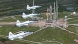 nasa t-38s fly over space launch system