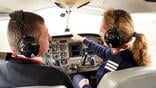 pilot trainee and flight instructor in cockpit