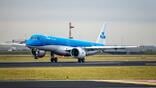 A KLM Cityhopper E195-E2 landing at Schiphol Airport.