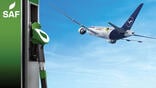 concept art of aircraft flying in background with sustainable aviation fuel pump in foreground