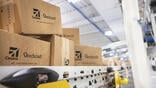 shipping boxes moving through a Textron Aviation automated conveyor facility