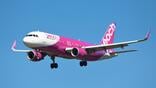 peach airbus a320-200 in flight