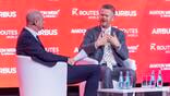 condor airlines CEO peter gerber with keynote interviewer at routes world 2026