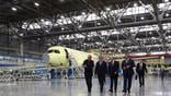 Russian President Vladimir Putin and officials tour Yakovlev MC-21 assembly line