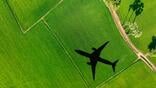 shadow of aircraft above green field
