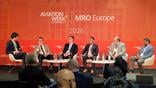 moderator and panelists onstage at mro europe