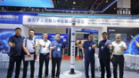 xuanwu space representatives next to rocket model at the wuxi space conference