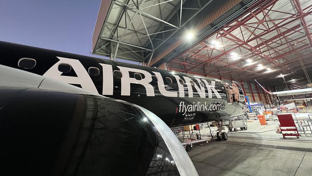 Airlink aircraft nosing into hangar