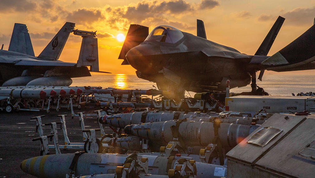 Lockheed Martin F-35s and missiles by the sea
