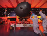 engineers working on spacecraft